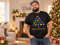 Thumbnail for Man wearing the black Invaders Christmas Tree T-shirt beside Christmas lights.