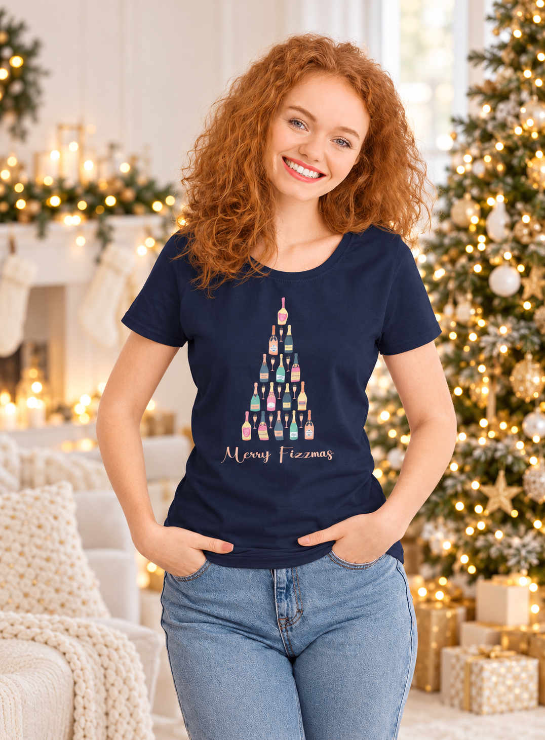 Woman wearing the navy Merry Fizzmas fitted T-shirt with a champagne-bottle Christmas tree design.