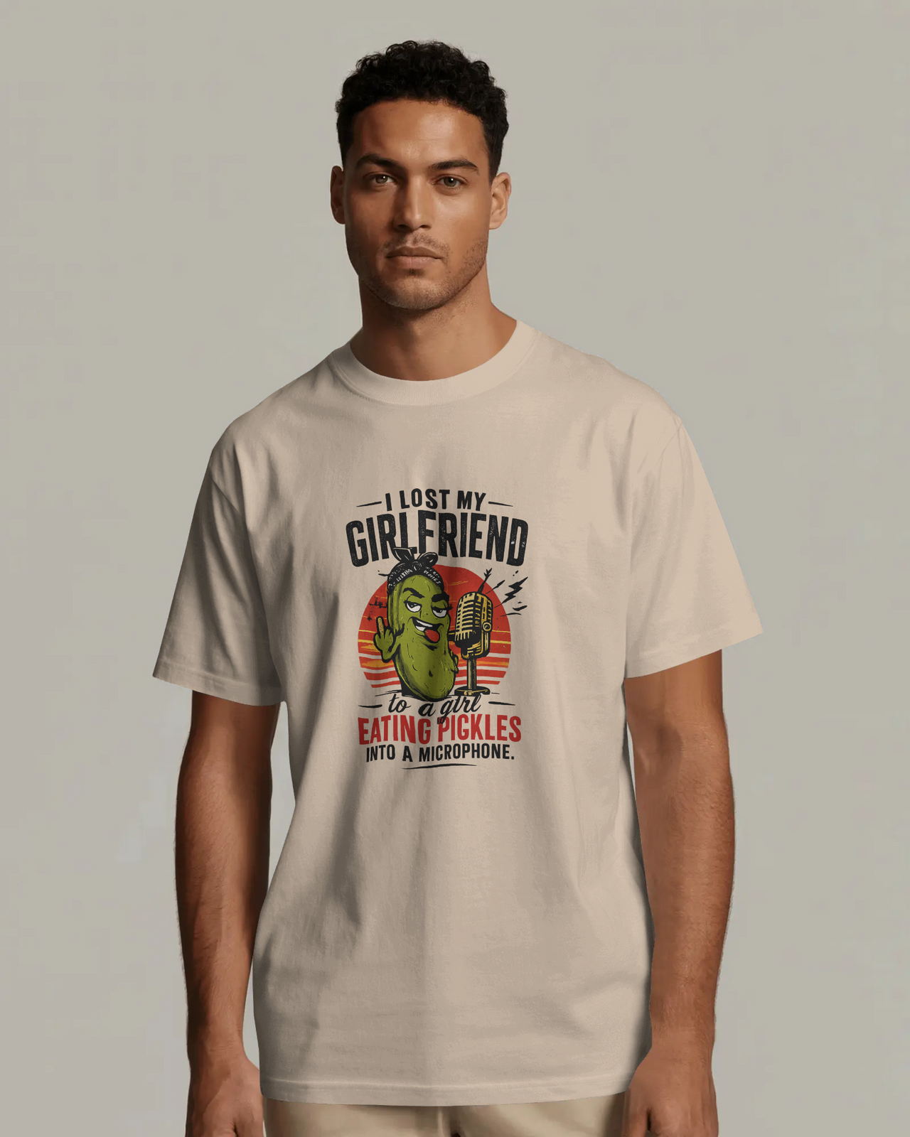 Man wearing a beige t-shirt with a graphic design and text. ASMR Took My Girl - The Pickle Whisperer