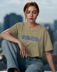 Thumbnail for Woman wearing a green t-shirt with text, sitting against a cityscape background - Good Morning That’s A Nice TNETENNBA - The IT Crowd T-Shirt
