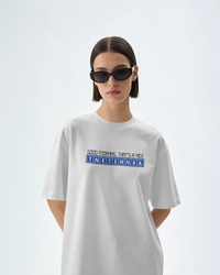 Thumbnail for Person wearing a white t-shirt with text on a light gray background - Good Morning That’s A Nice TNETENNBA - The IT Crowd T-Shirt