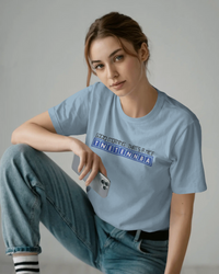 Thumbnail for Person wearing a light blue t-shirt with text, sitting against a plain background - Good Morning That’s A Nice TNETENNBA - The IT Crowd T-Shirt