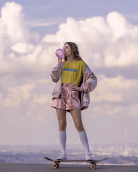 Thumbnail for Person skateboarding with a colorful outfit against a cloudy sky. - IT Crowd - Tnetennba