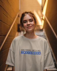 Thumbnail for Person wearing a light grey t-shirt with text in an indoor setting - IT Crowd - Tnetennba