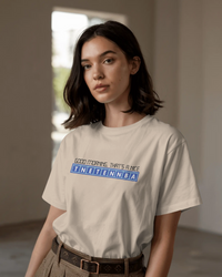 Thumbnail for Person wearing a beige t-shirt with text in an indoor setting - IT Crowd - Tnetennba