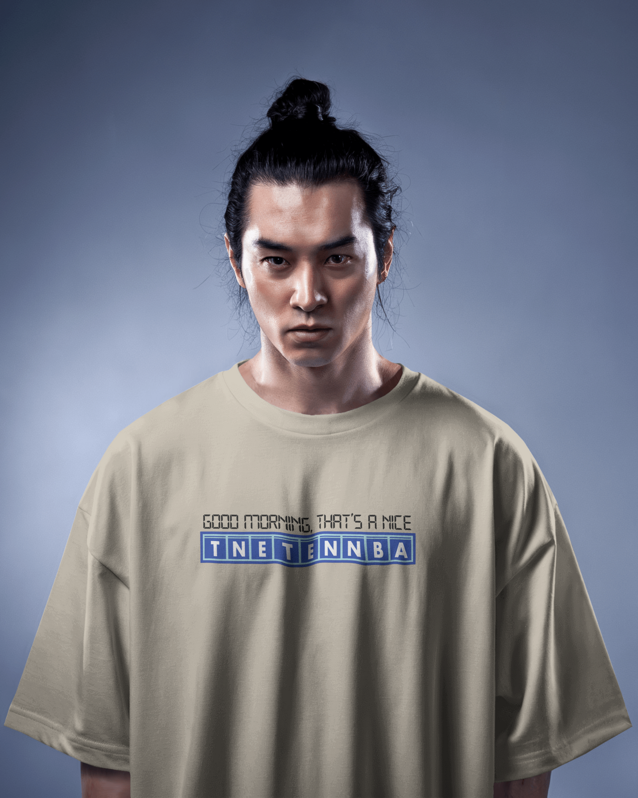 Person wearing a beige t-shirt with text on a gray background - IT Crowd - Tnetennba
