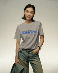 Thumbnail for Person wearing a gray t-shirt with text and blue jeans on a plain background - IT Crowd - Tnetennba
