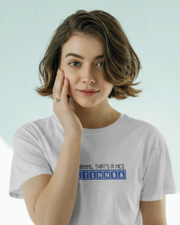Thumbnail for Person wearing a white t-shirt with text on a light blue background - IT Crowd - Tnetennba