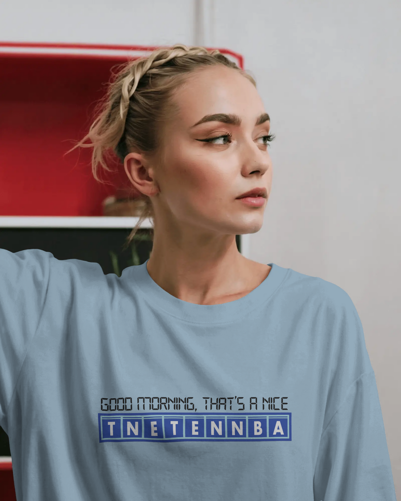 Woman wearing a light blue t-shirt with text design - IT Crowd - Tnetennba
