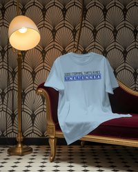 Thumbnail for Light blue t-shirt with text on a red and gold ornate chair with decorative wall and floor. - IT Crowd - Tnetennba
