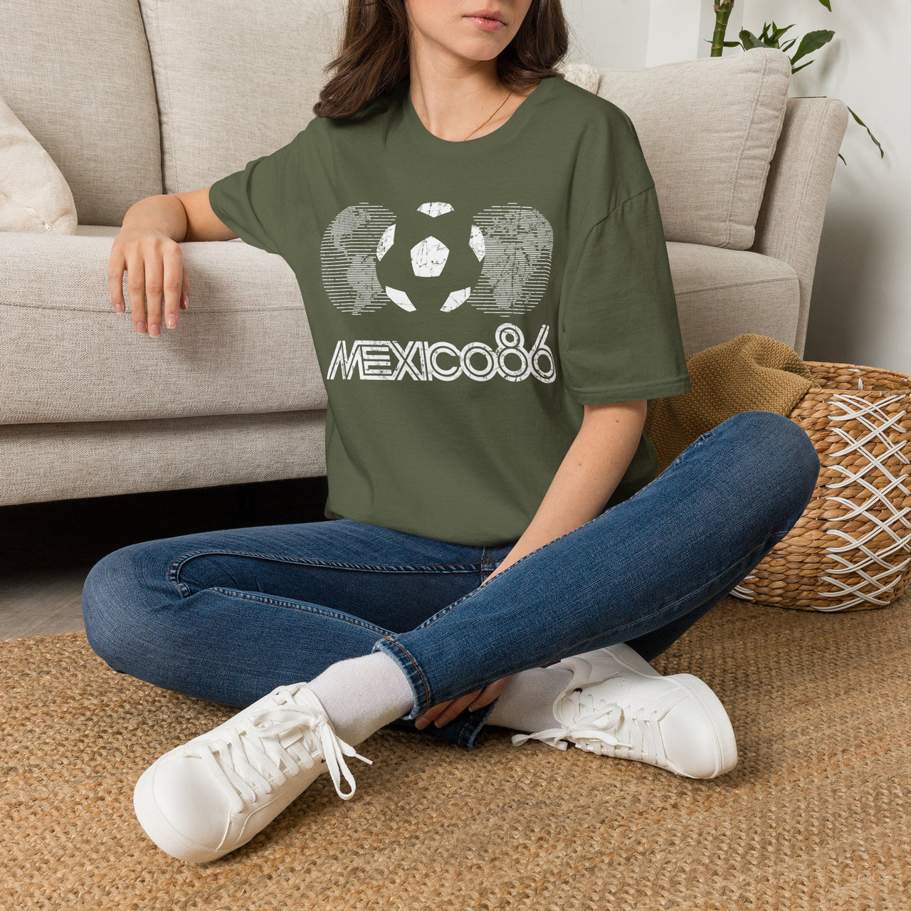 Person wearing a green Vintage t-shirt with 'Mexico 86' design sitting on the floor. World Cup 2026