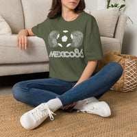 Thumbnail for Person wearing a green Vintage t-shirt with 'Mexico 86' design sitting on the floor. World Cup 2026