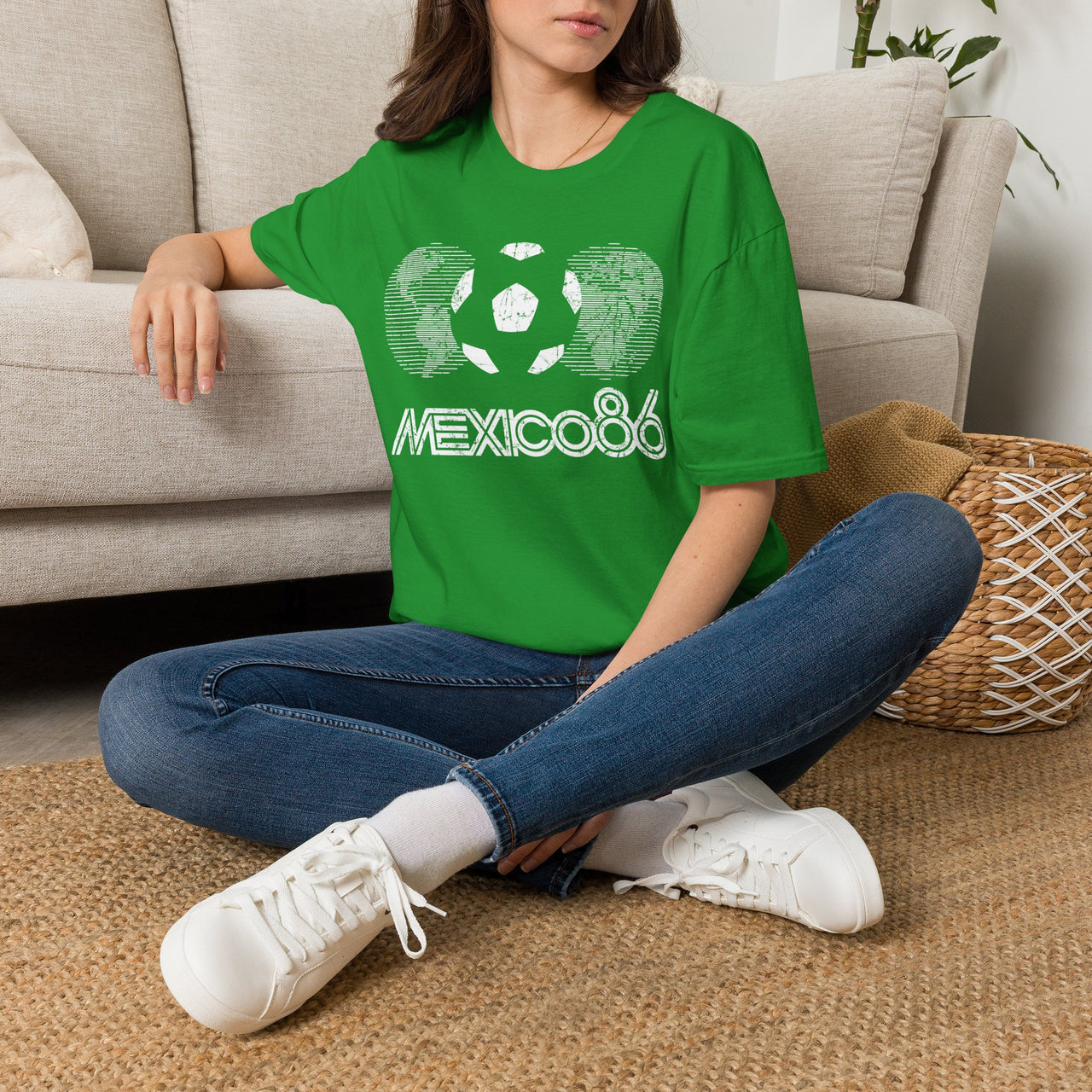 Person wearing a Mexican Green Vintage t-shirt with 'Mexico 86' design sitting on the floor. World Cup 2026