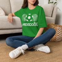Thumbnail for Person wearing a Mexican Green Vintage t-shirt with 'Mexico 86' design sitting on the floor. World Cup 2026