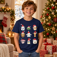 Thumbnail for Child wearing the navy Animals Christmas T-shirt with nine animal faces in Santa hats beside a decorated Christmas tree.