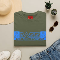 Thumbnail for An olive green t-shirt with a blue and gray retro 'BASS THE FINAL FRONTIER' graphic, styled in a flat lay with a straw hat, white sneakers, blue jeans, sunglasses, and small potted succulents on a light beige background.