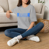 Thumbnail for Person sitting on the floor wearing a gray t-shirt with text and blue jeans, in a living room setting.