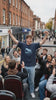 Bus Wankers T-Shirt inspired by The Inbetweeners worn near a bus in a comedy lifestyle video