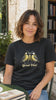 Black Great Tits bird pun T-shirt short Reel filmed in a bookshop courtyard setting.