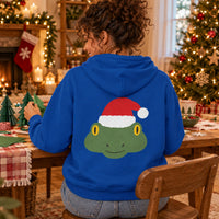 Thumbnail for Santa Frog Christmas Back Print Hoodie in Royal, worn in a Christmas home setting with the Santa frog back print visible.