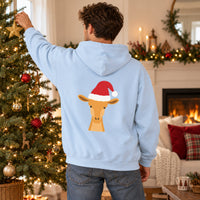 Thumbnail for Santa Giraffe Christmas Back Print Hoodie in Light Blue, worn in a Christmas home setting with the Santa giraffe back print visible.