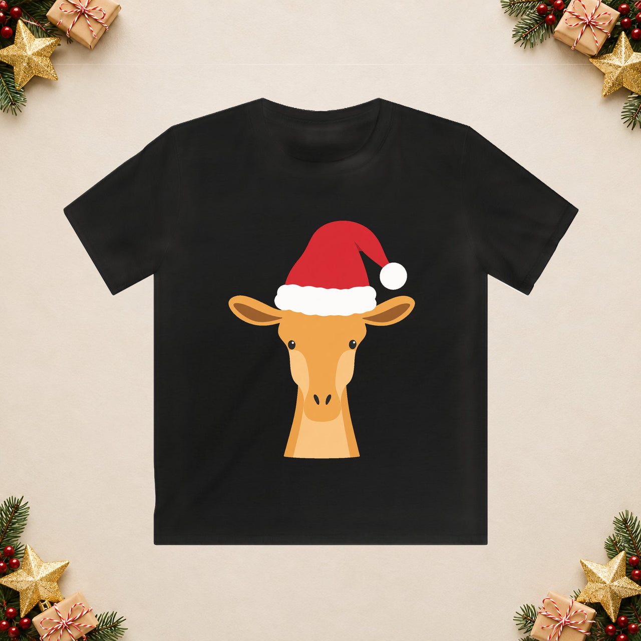 Santa giraffe Christmas kids t shirt in Black, front view with the Santa animal illustration on a Christmas flat-lay background.