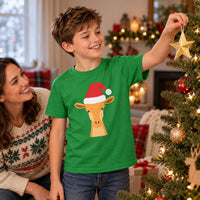 Thumbnail for Santa Giraffe Christmas Kids T-Shirt in Irish Green, worn in a Christmas home setting with the Santa giraffe front print visible.