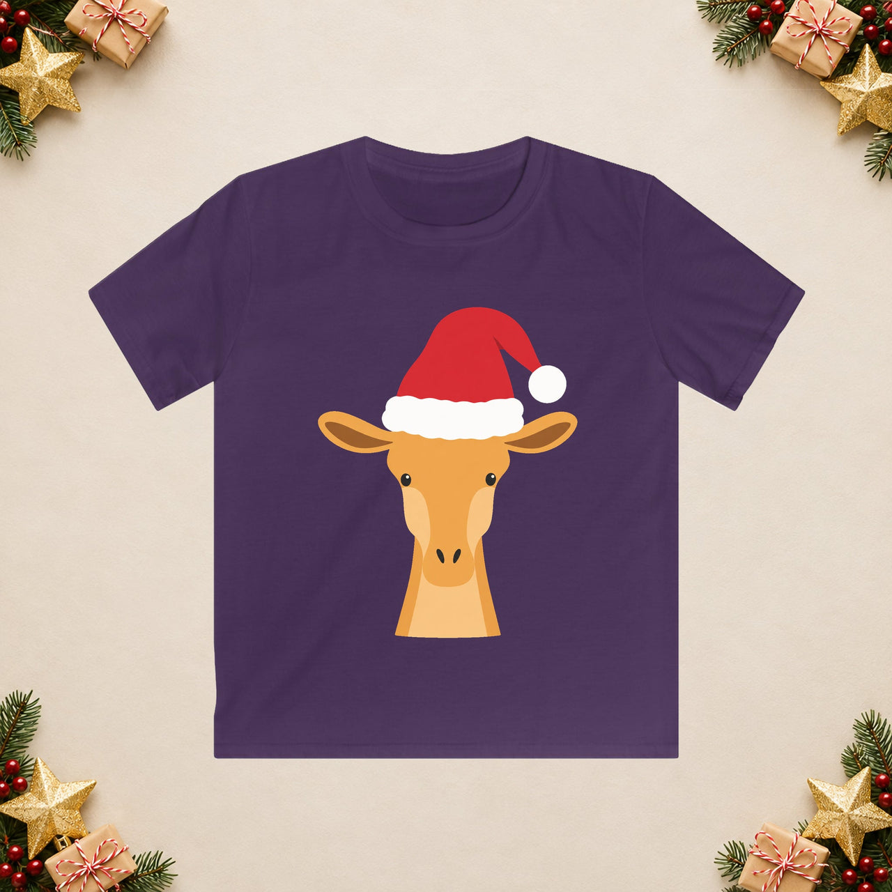 Santa giraffe Christmas kids t shirt in Purple, front view with the Santa animal illustration on a Christmas flat-lay background.