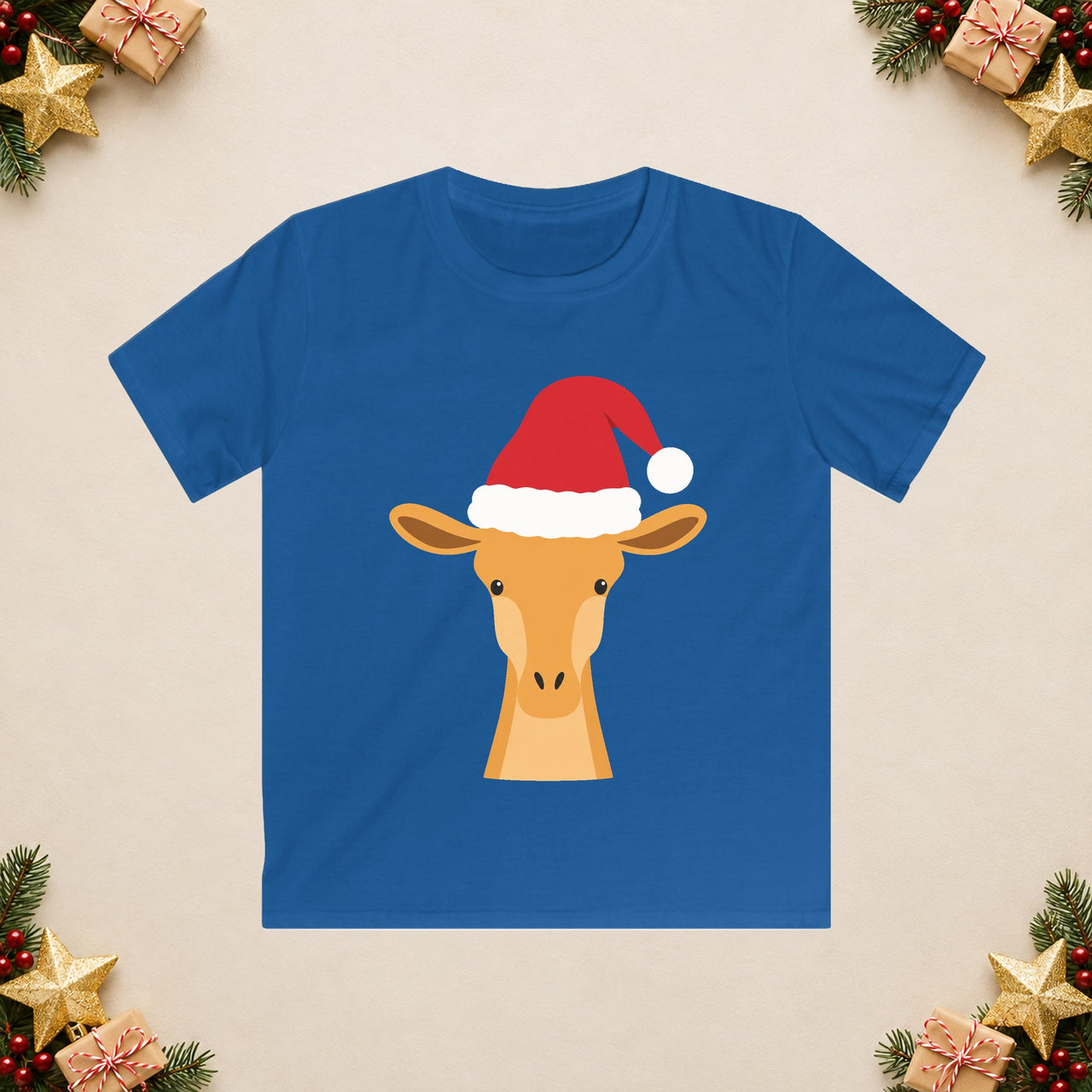 Santa giraffe Christmas kids t shirt in Royal, front view with the Santa animal illustration on a Christmas flat-lay background.