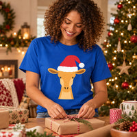 Thumbnail for Santa Giraffe Christmas Unisex T-Shirt in Royal, worn in a Christmas home setting with the Santa giraffe front print visible.