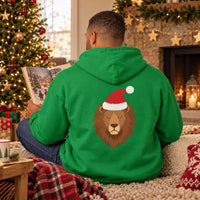 Thumbnail for Santa Lion Christmas Back Print Hoodie in Irish Green, worn in a Christmas home setting with the Santa lion back print visible.