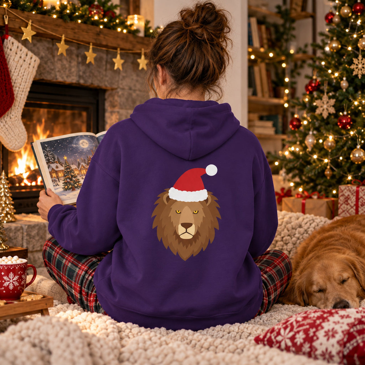 Santa Lion Christmas Back Print Hoodie in Purple, worn in a Christmas home setting with the Santa lion back print visible.