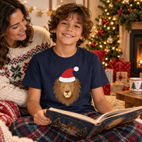 Thumbnail for Santa Lion Christmas Kids T-Shirt in Navy, worn in a Christmas home setting with the Santa lion front print visible.