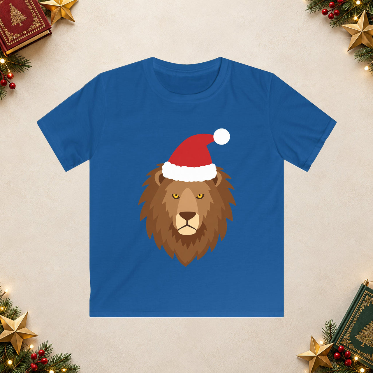 Santa lion Christmas kids t shirt in Royal, front view with the Santa animal illustration on a Christmas flat-lay background.