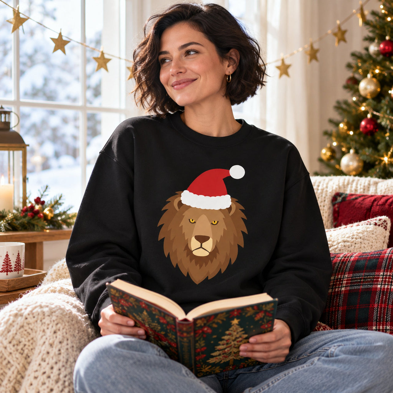 Santa Lion Christmas Sweatshirt in Black, worn in a Christmas home setting with the Santa lion front print visible.