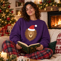 Thumbnail for Santa Lion Christmas Sweatshirt in Purple, worn in a Christmas home setting with the Santa lion front print visible.