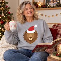 Thumbnail for Santa Lion Christmas Sweatshirt in Sport Grey, worn in a Christmas home setting with the Santa lion front print visible.
