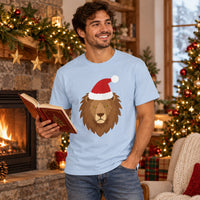 Thumbnail for Santa Lion Christmas Unisex T-Shirt in Light Blue, worn in a Christmas home setting with the Santa lion front print visible.
