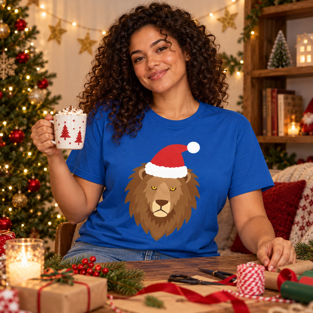 Santa Lion Christmas Unisex T-Shirt in Royal, worn in a Christmas home setting with the Santa lion front print visible.