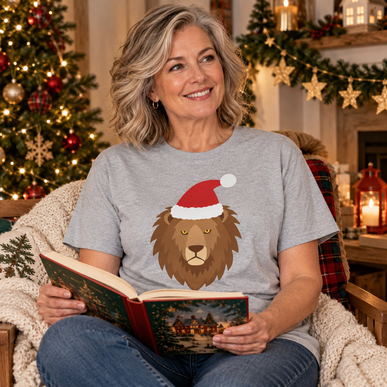 Santa Lion Christmas Unisex T-Shirt in Sport Grey, worn in a Christmas home setting with the Santa lion front print visible.