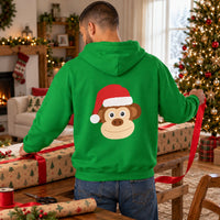 Thumbnail for Santa Monkey Christmas Back Print Hoodie in Irish Green, worn in a Christmas home setting with the Santa monkey back print visible.