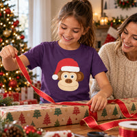 Thumbnail for Santa Monkey Christmas Kids T-Shirt in Purple, worn in a Christmas home setting with the Santa monkey front print visible.
