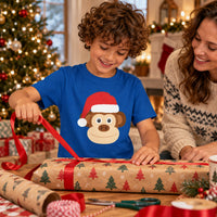 Thumbnail for Santa Monkey Christmas Kids T-Shirt in Royal, worn in a Christmas home setting with the Santa monkey front print visible.