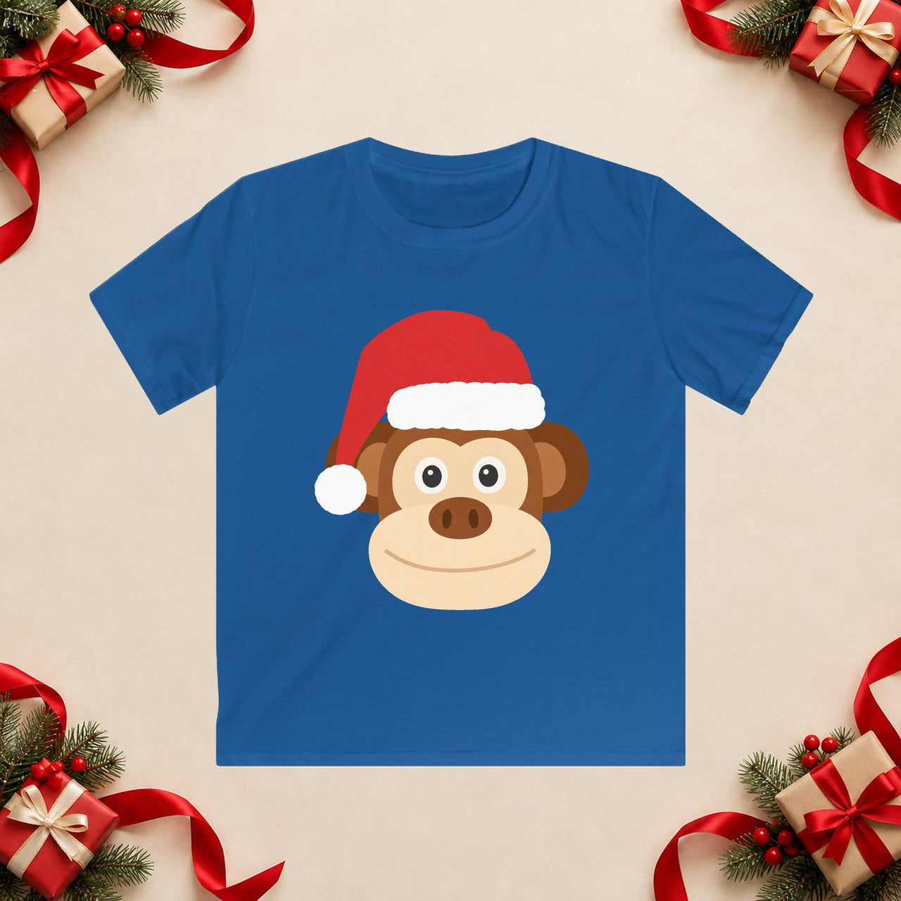 Santa monkey Christmas kids t shirt in Royal, front view with the Santa animal illustration on a Christmas flat-lay background.