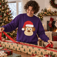 Thumbnail for Santa Monkey Christmas Sweatshirt in Purple, worn in a Christmas home setting with the Santa monkey front print visible.