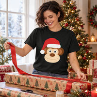 Thumbnail for Santa Monkey Christmas Unisex T-Shirt in Black, worn in a Christmas home setting with the Santa monkey front print visible.