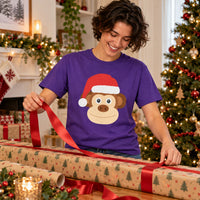 Thumbnail for Santa Monkey Christmas Unisex T-Shirt in Purple, worn in a Christmas home setting with the Santa monkey front print visible.