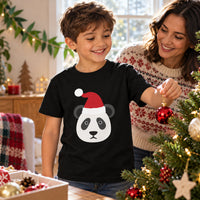 Thumbnail for Santa Panda Christmas kids t shirt in Black, worn in a festive home setting with the Santa panda front print visible.