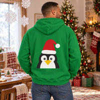 Thumbnail for Santa Penguin Christmas back print hoodie in Irish Green, worn in a Christmas home setting with the Santa penguin back print visible.