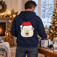 Thumbnail for Santa Polar Bear Christmas back print hoodie in Navy, worn in a Christmas home setting with the Santa polar bear back print visible.
